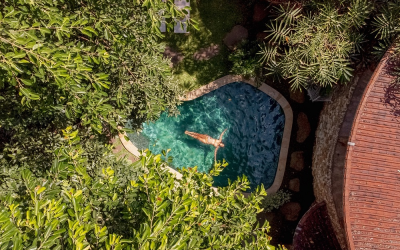 Wind down in the pool, surrounded by trees that provide a welcome shadow.