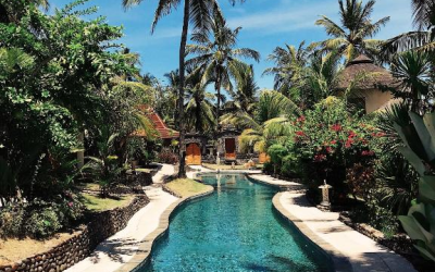 Pools surrounded by lush gardens.